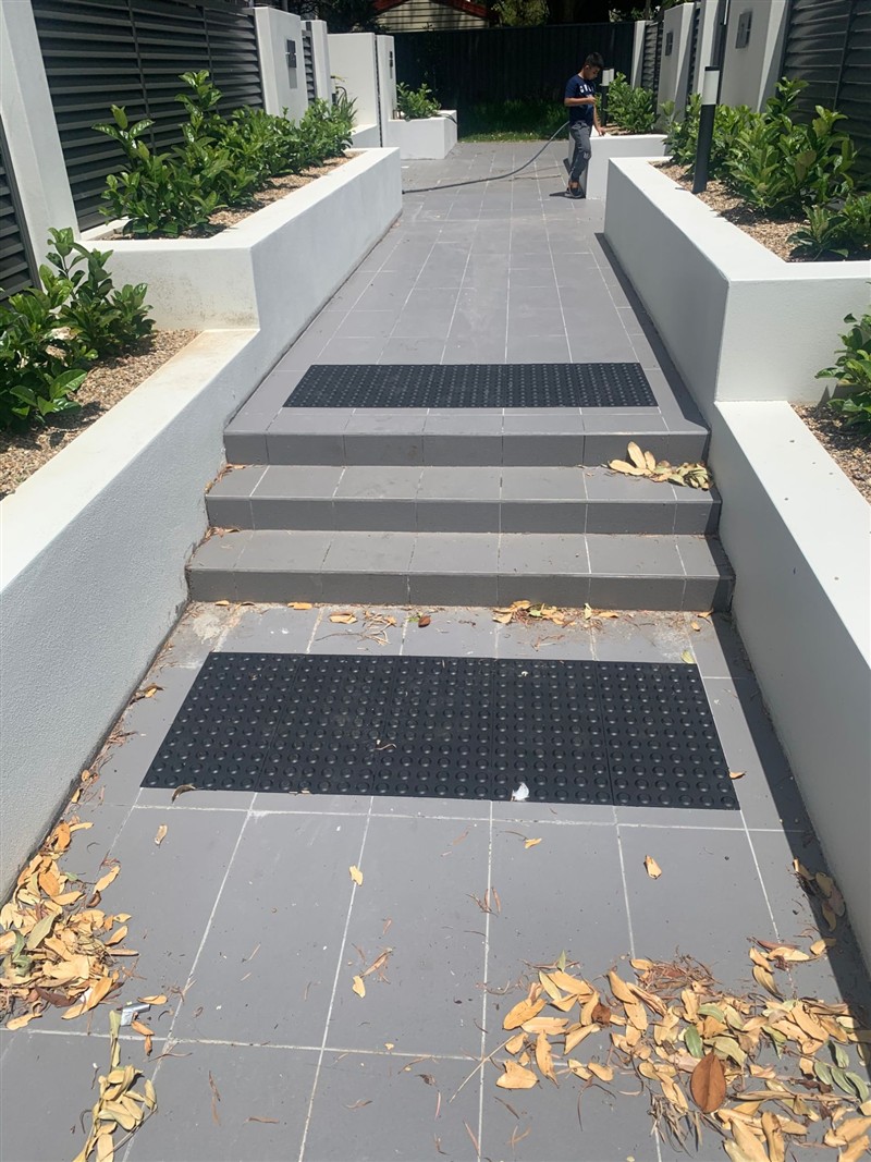 Tactile indicators at the top of a flight of stairs
