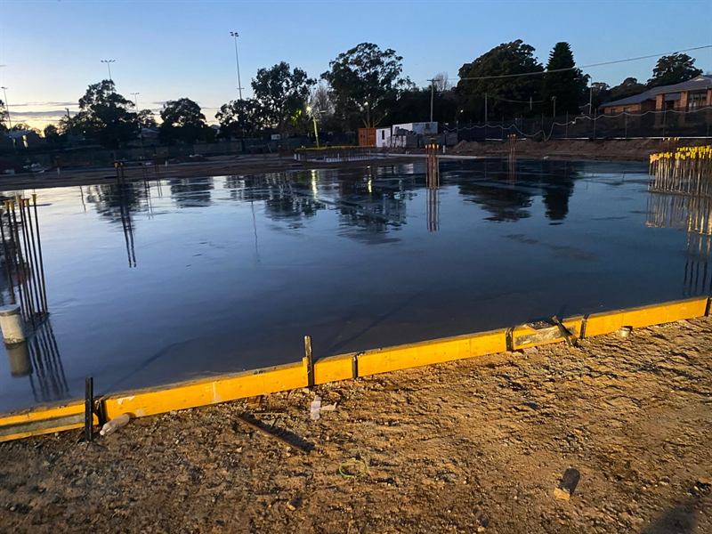 Freshly poured slab and formwork at first light
