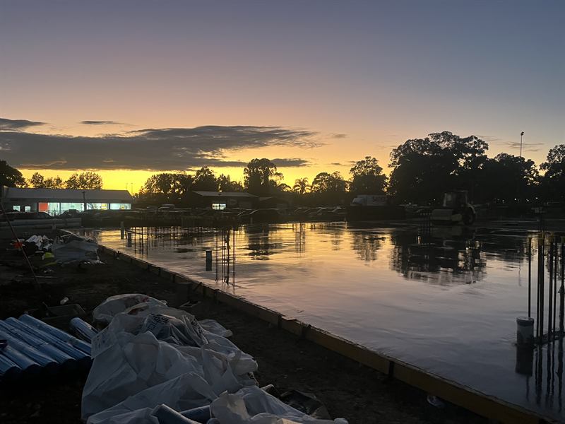 Freshly poured slab being cured in the early morning