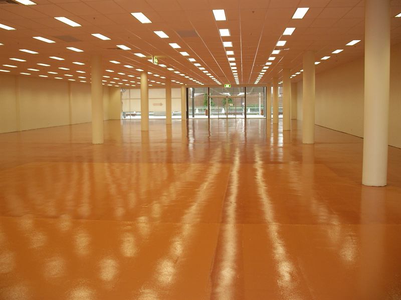 Large hall finished in orange epoxy