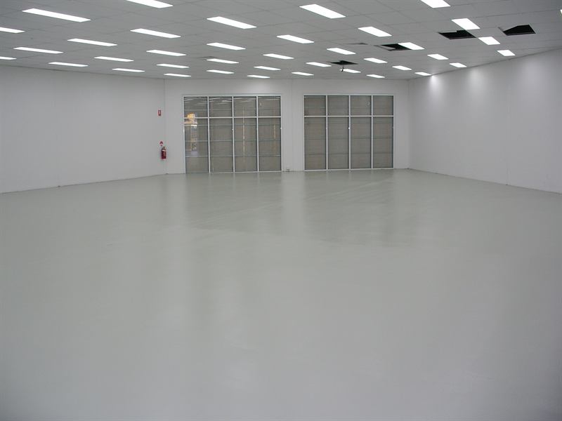 Showroom floor after: finished light grey epoxy