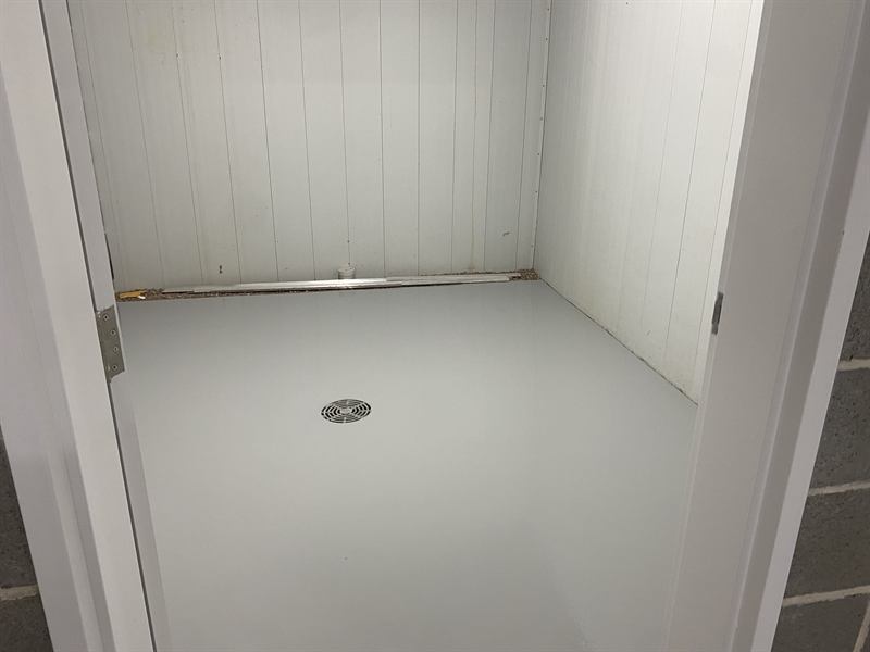 Grey epoxy floor in a building service room