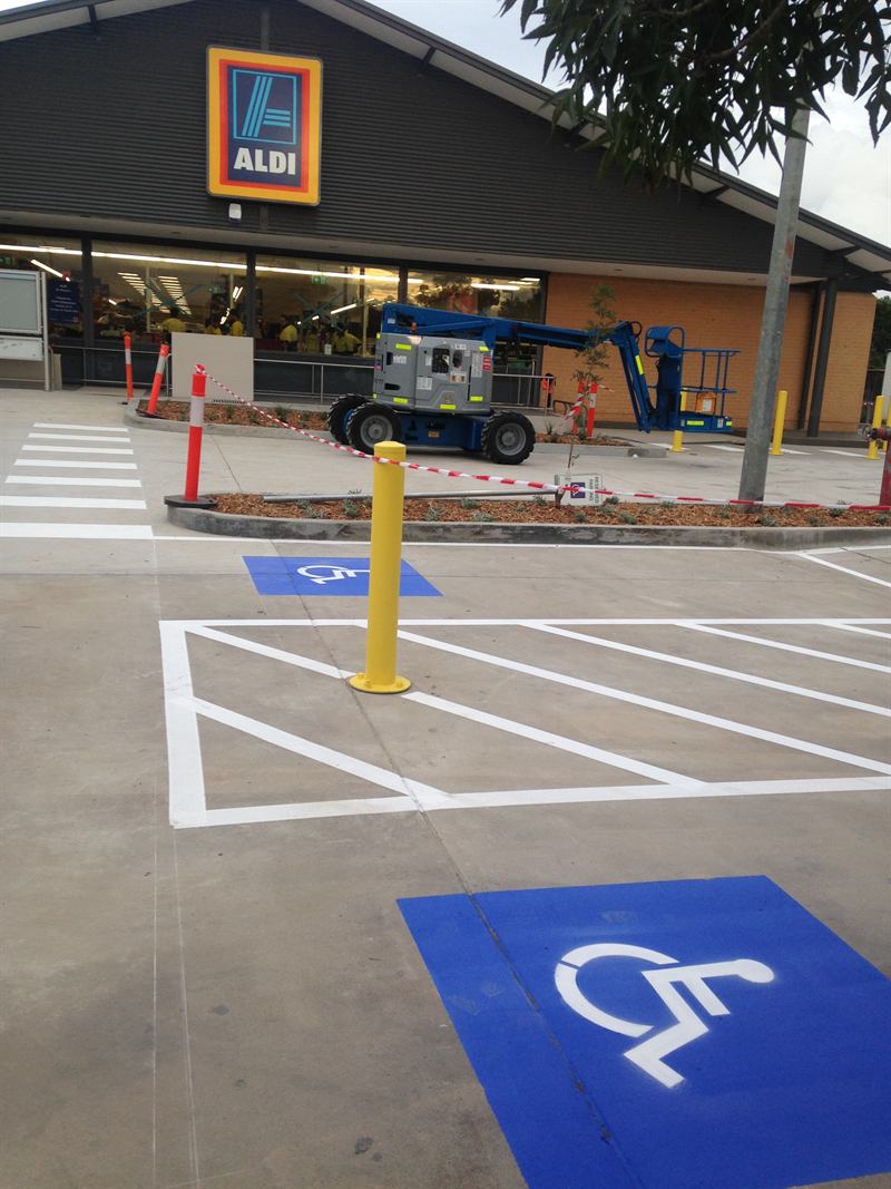Disabled bay and hatched zone outside a supermarket