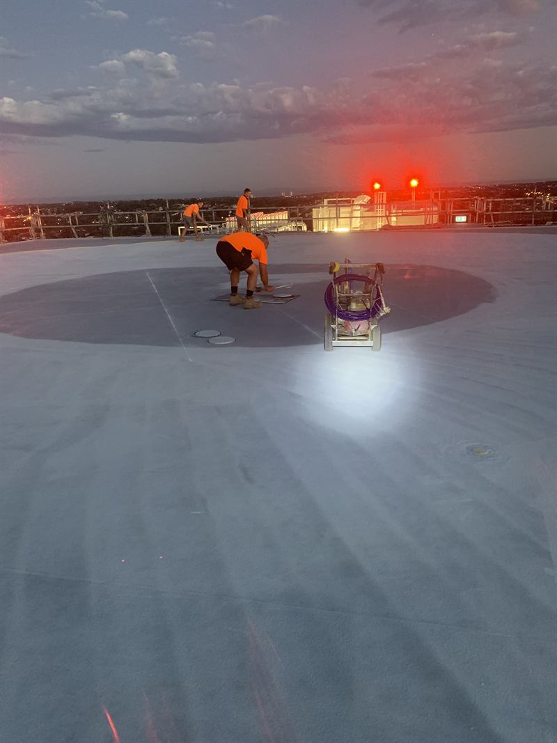 ACS crew setting out helipad markings at dusk