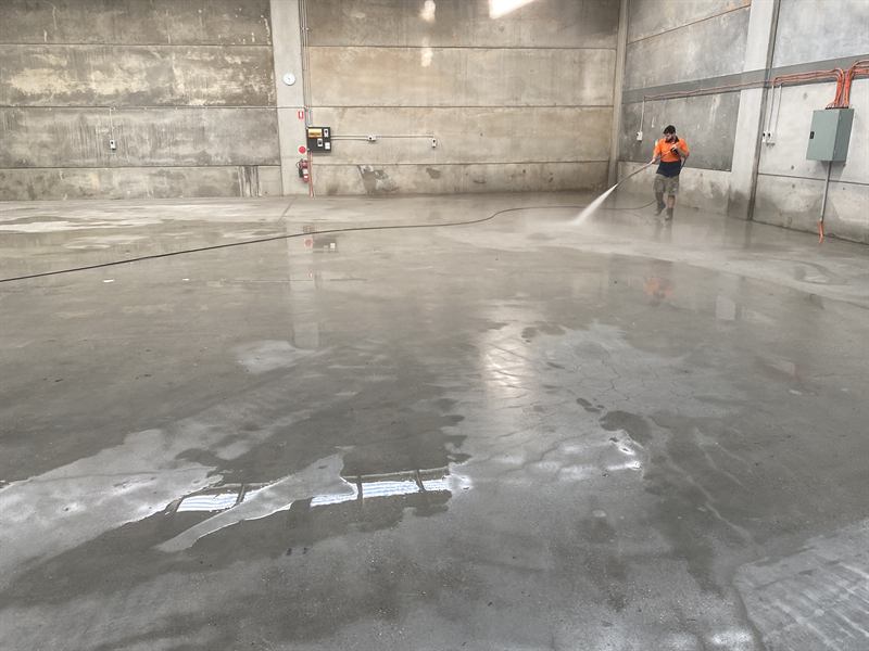 Pressure cleaning a large warehouse floor